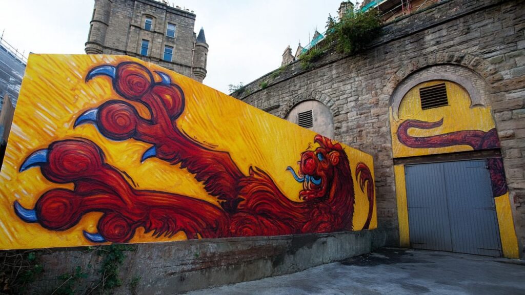 Mural featuring Saltire, lion rampant, and mythical creatures in Scottish folklore.
